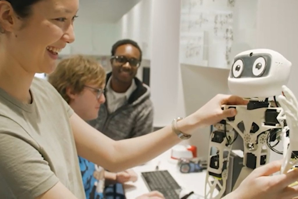 Scientist with robot 
